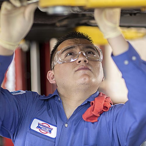 Mechanic repairing car